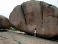 my neice standing next to the biggest rock on the highest point