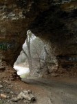 In this picture of the arch, you can see the vehicle tracks where people pull through and then drive into the cave.